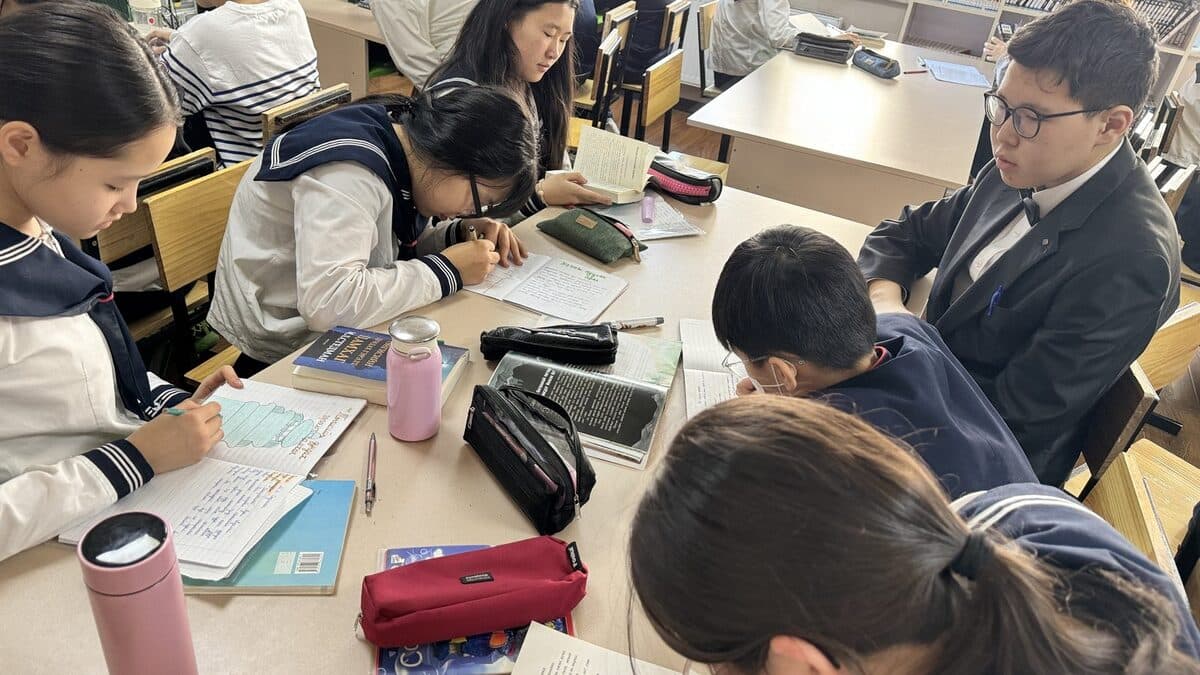 High school students taking notes in class